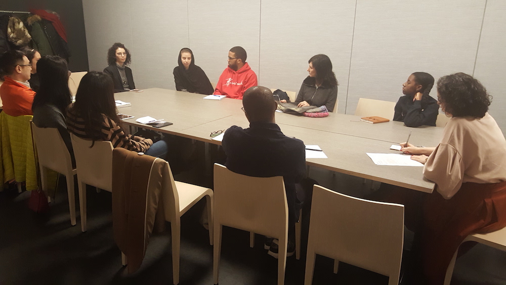 students seated around table